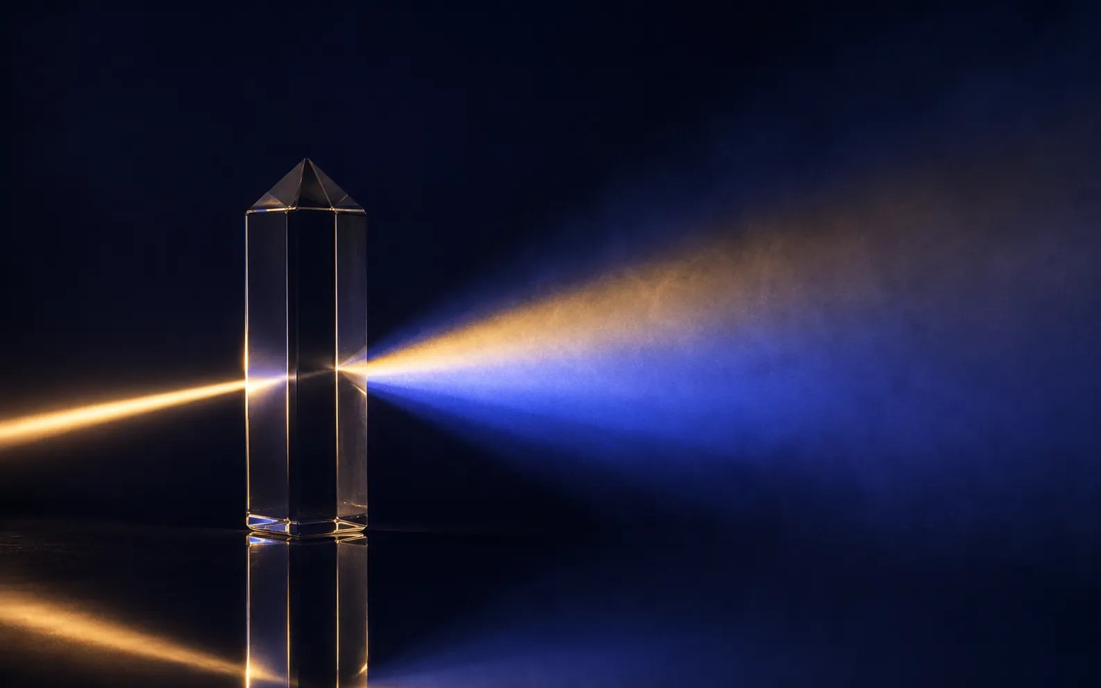 Glass prism turning one warm beam into a fan of blue light — audit and assurance services that bring clarity